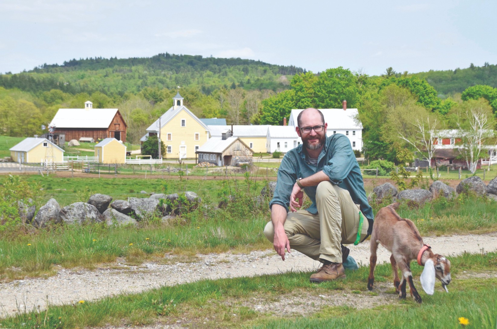 Jim Cruickshank, program manager, and goat kid on the Binsack Trail at